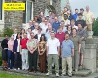 Group of people pose for photo on stairs